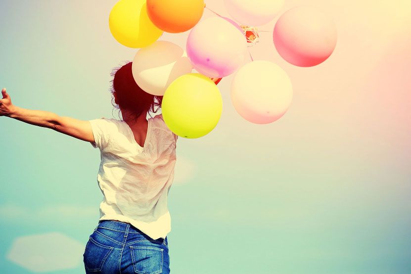 Person Running with Balloons